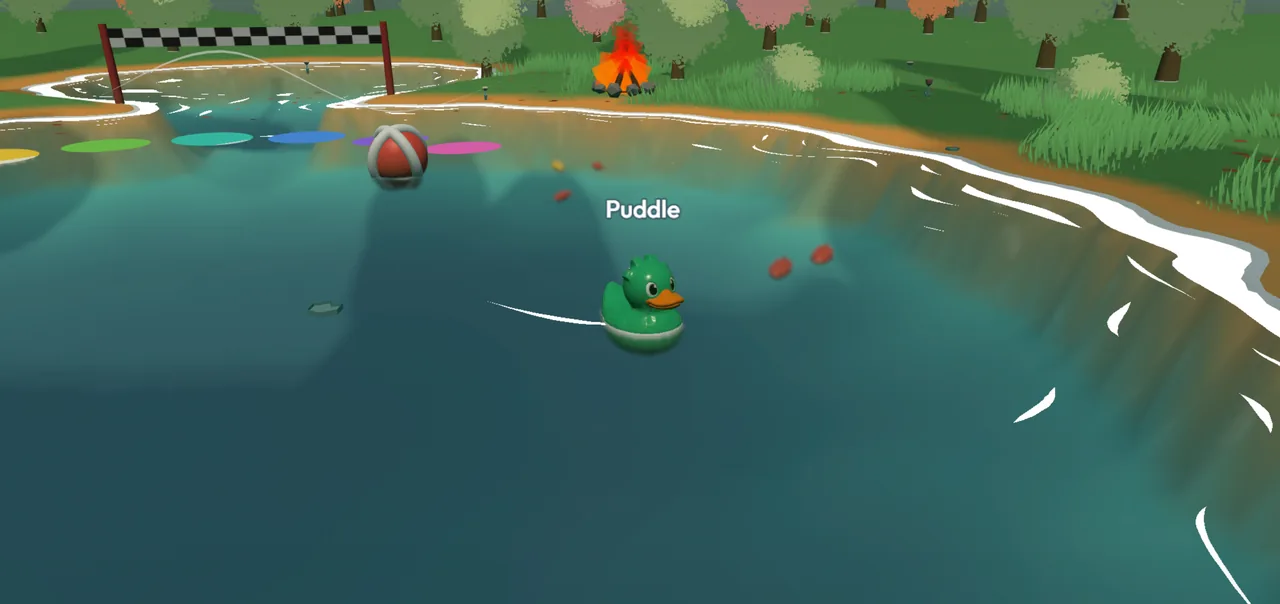 The Pond de jour : un canard vert nommé Puddle nage près de nénuphars, d'un ballon de plage et d'un feu de camp